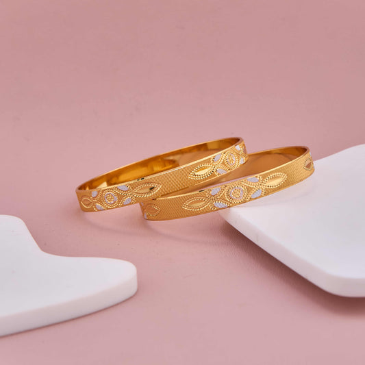 Traditional Gold Bangles with Silver Floral Accents
