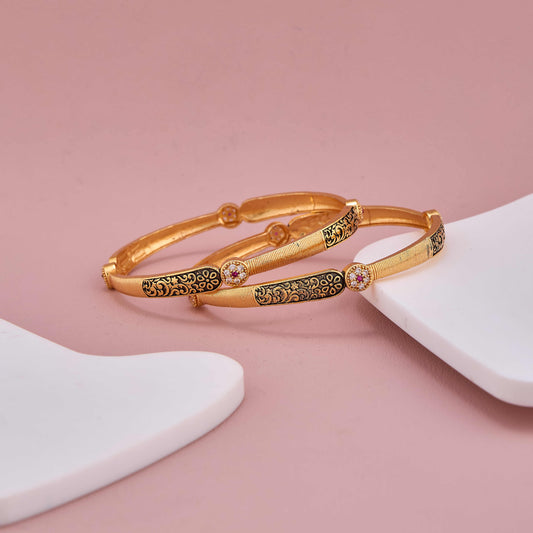 Golden Elegance Bangles with Black Detailing and Sparkling Stones
