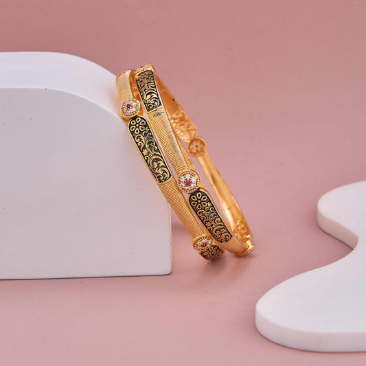 Golden Elegance Bangles with Black Detailing and Sparkling Stones